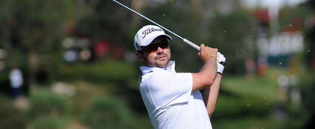 GUADALAJARA, MEXICO - MAR. 22, 2014: El colombiano Marcelo Rozo durante la tercera ronda del TransAmerican Power Products CRV Open en Las Lomas Club de Golf. / Colombia's Marcelo Rozo during the third round of the TransAmerican Power Products CRV Open at Las Lomas Club de Golf.